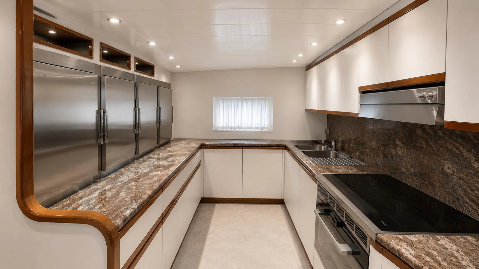 The yacht's galley features modern appliances and ample counter space for gourmet cooking. aboard ALPHERATZ Yacht for Sale