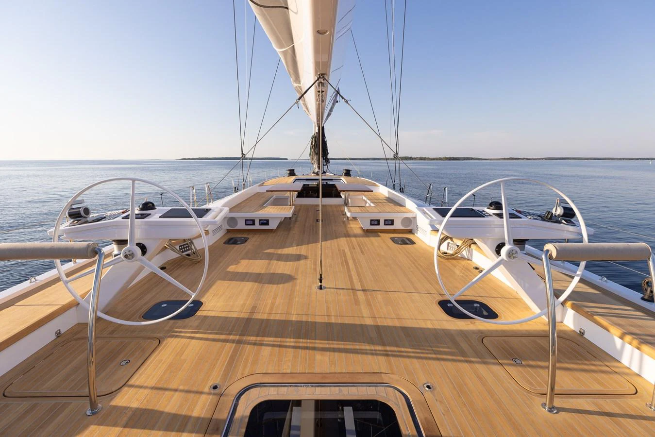 The yacht's deck features dual helm stations and a spacious layout, perfect for navigating serene waters. aboard DREAMCATCHER Yacht for Sale