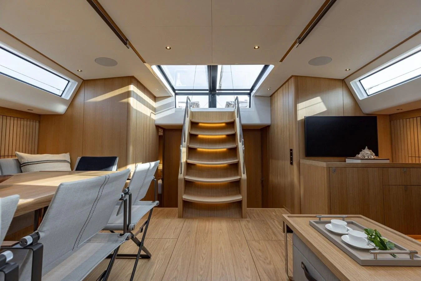 The salon features a modern design with ample natural light and comfortable seating. aboard DREAMCATCHER Yacht for Sale