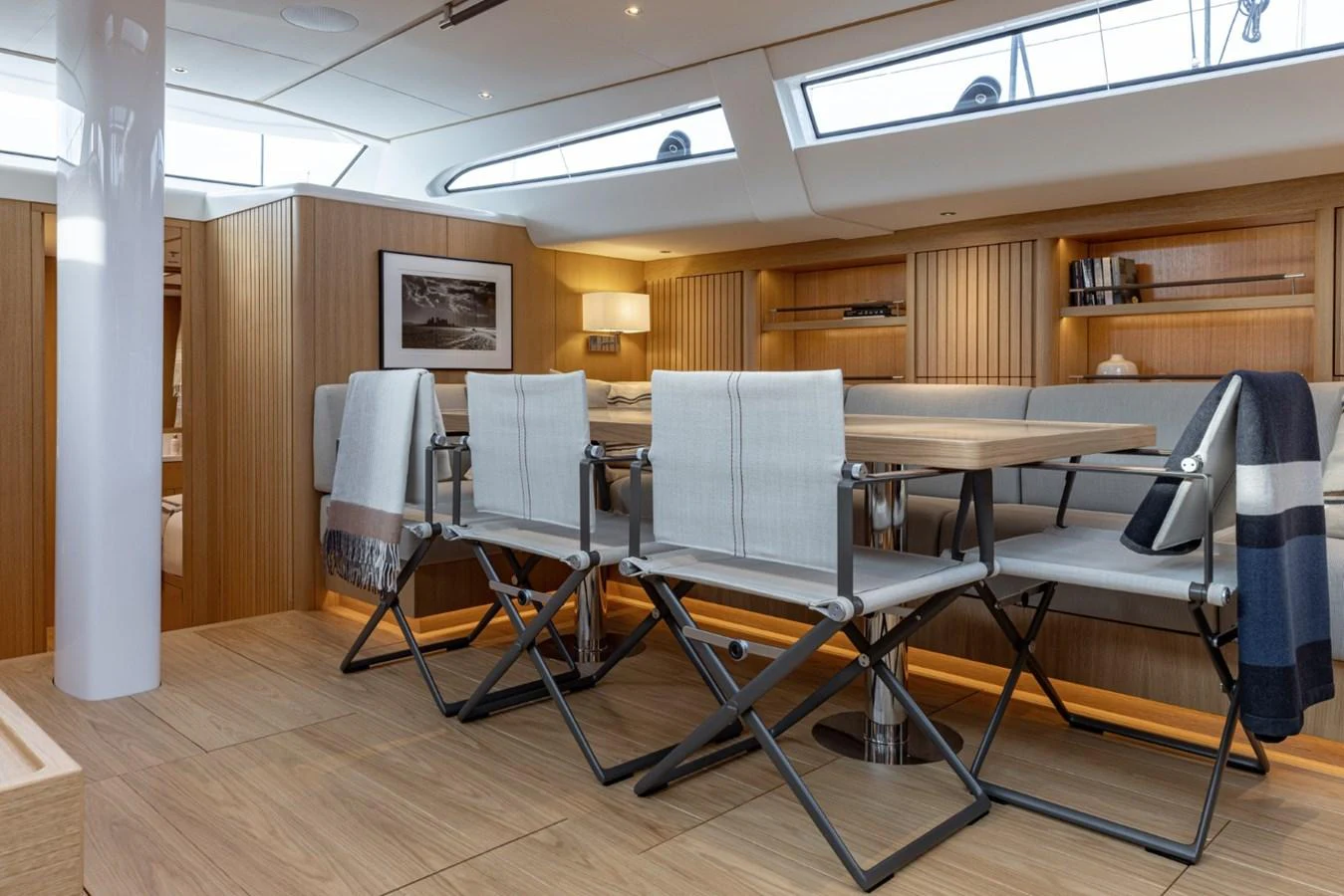 The yacht's dining area features elegant seating and a modern, well-lit ambiance. aboard DREAMCATCHER Yacht for Sale