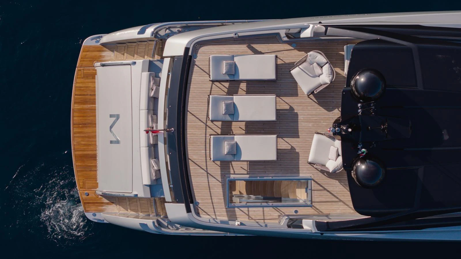 The sundeck offers a luxurious space for relaxation with sun loungers and seating areas. aboard M Yacht for Sale