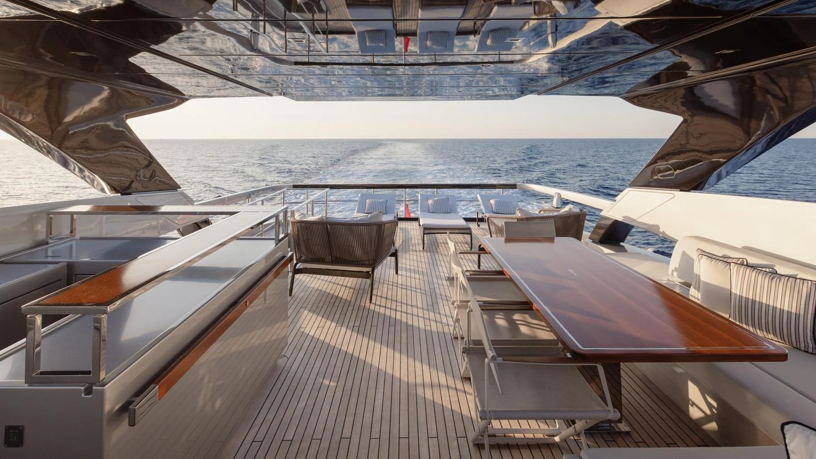 The aft deck offers a spacious and elegant area for dining and relaxation with stunning ocean views. aboard M Yacht for Sale