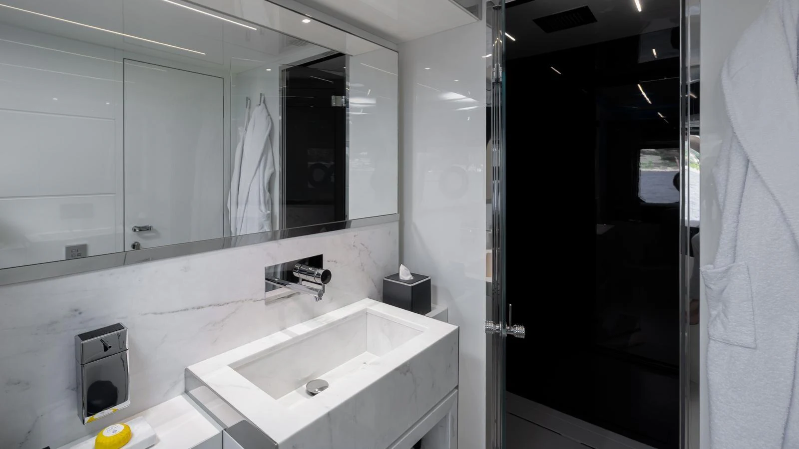 The yacht's bathroom features a sleek, modern design with high-end fixtures and a luxurious ambiance. aboard M Yacht for Sale