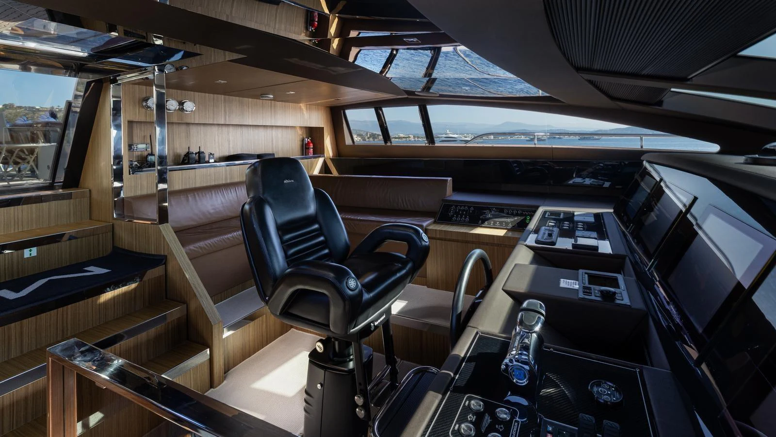 The helm station features a sleek, modern design with advanced navigation equipment and luxurious seating. aboard M Yacht for Sale