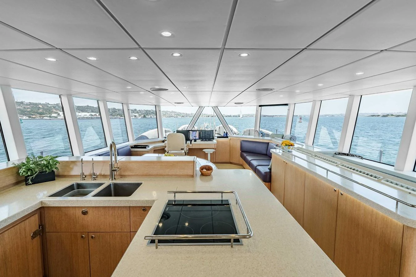 The spacious galley offers panoramic views and modern amenities for a luxurious culinary experience. aboard UGLY BETTY Yacht for Sale