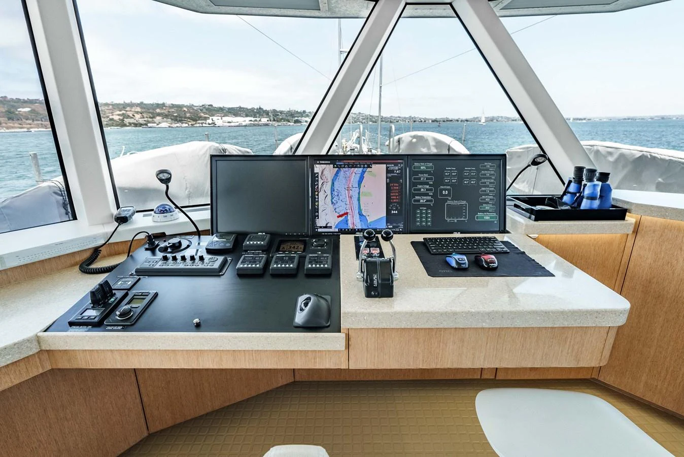 The helm station offers a modern and well-equipped command center with panoramic views. aboard UGLY BETTY Yacht for Sale