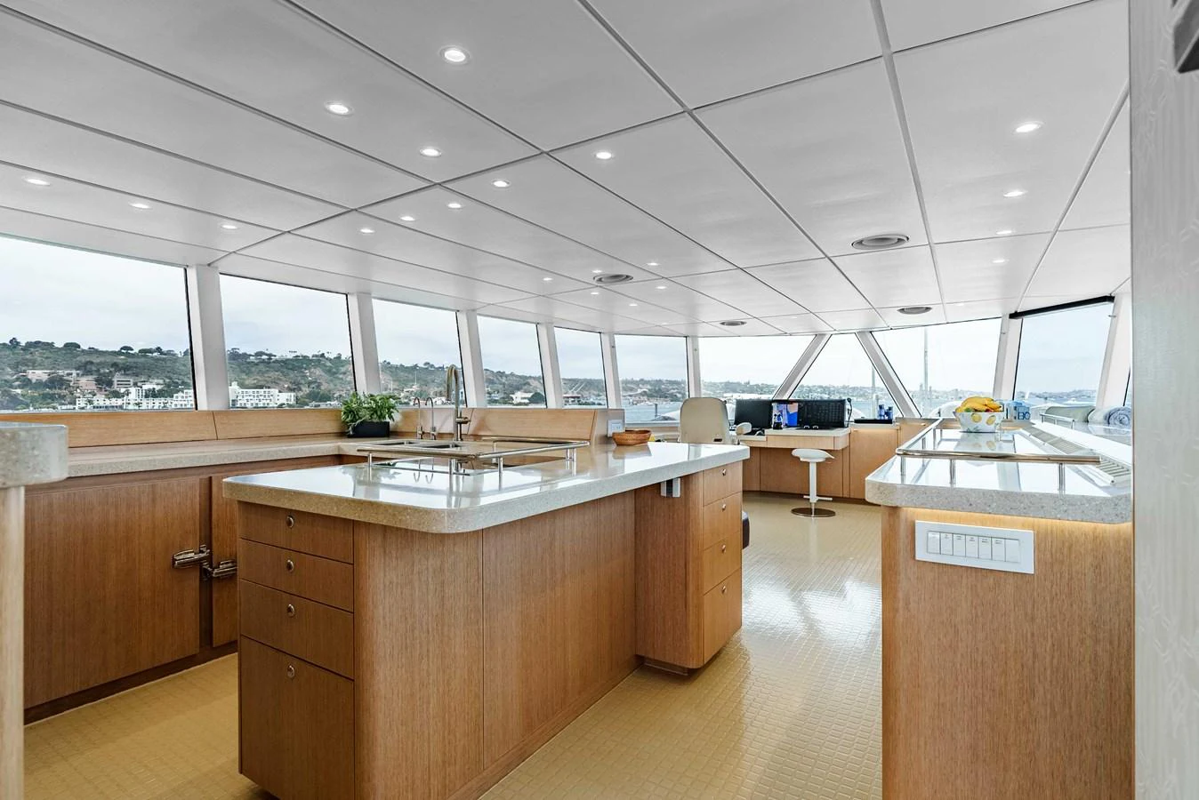 The spacious galley features modern appliances and panoramic windows offering stunning views. aboard UGLY BETTY Yacht for Sale