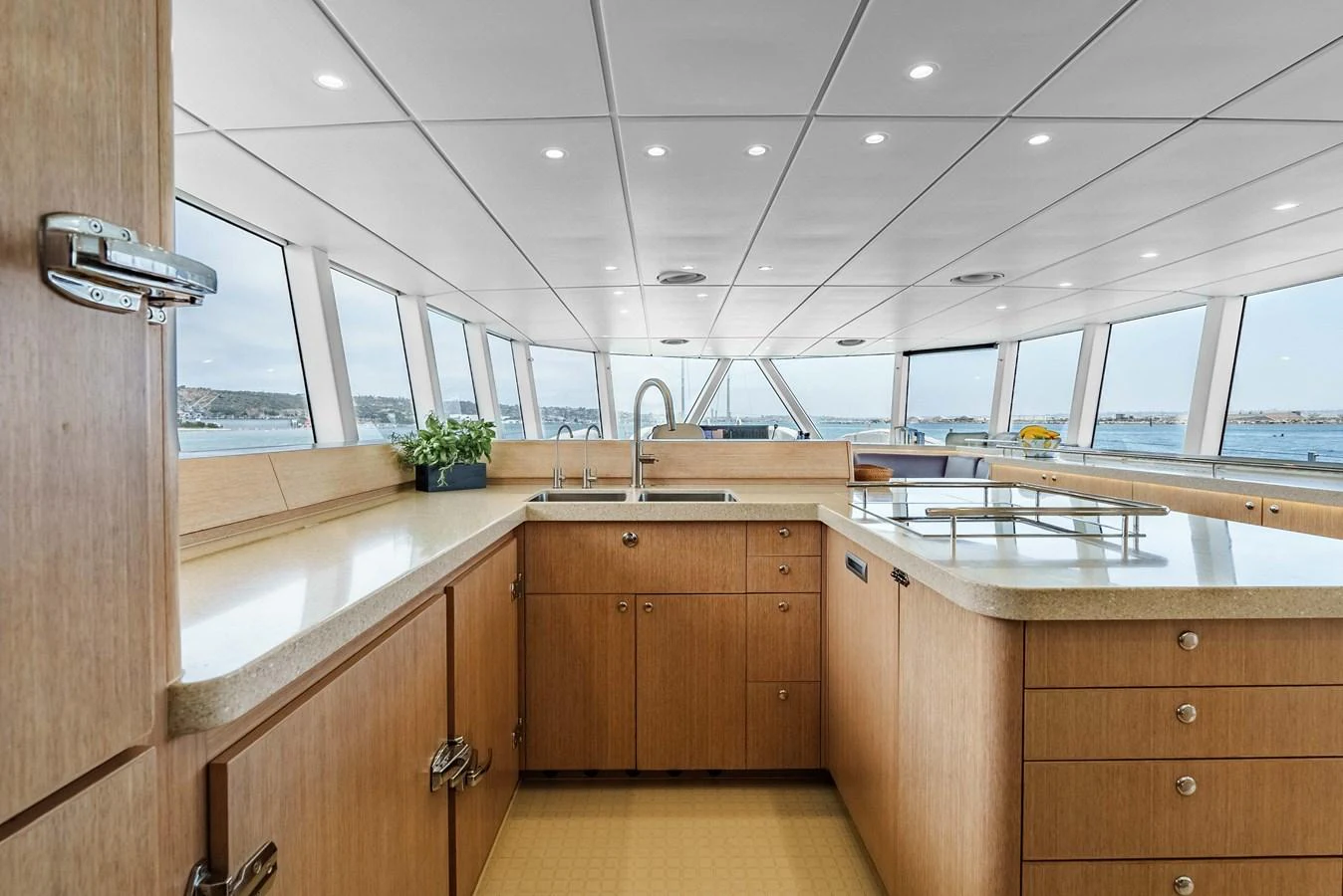 The yacht's galley features modern appliances and expansive windows offering stunning sea views. aboard UGLY BETTY Yacht for Sale