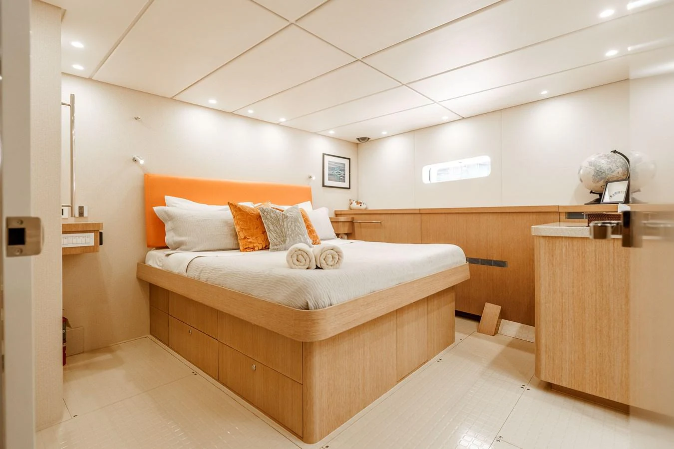 The stateroom features a comfortable bed with elegant decor and ample natural light. aboard UGLY BETTY Yacht for Sale