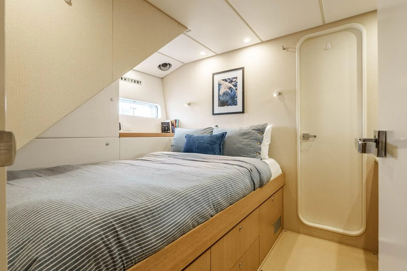 A cozy stateroom with a comfortable bed and modern decor. aboard UGLY BETTY Yacht for Sale
