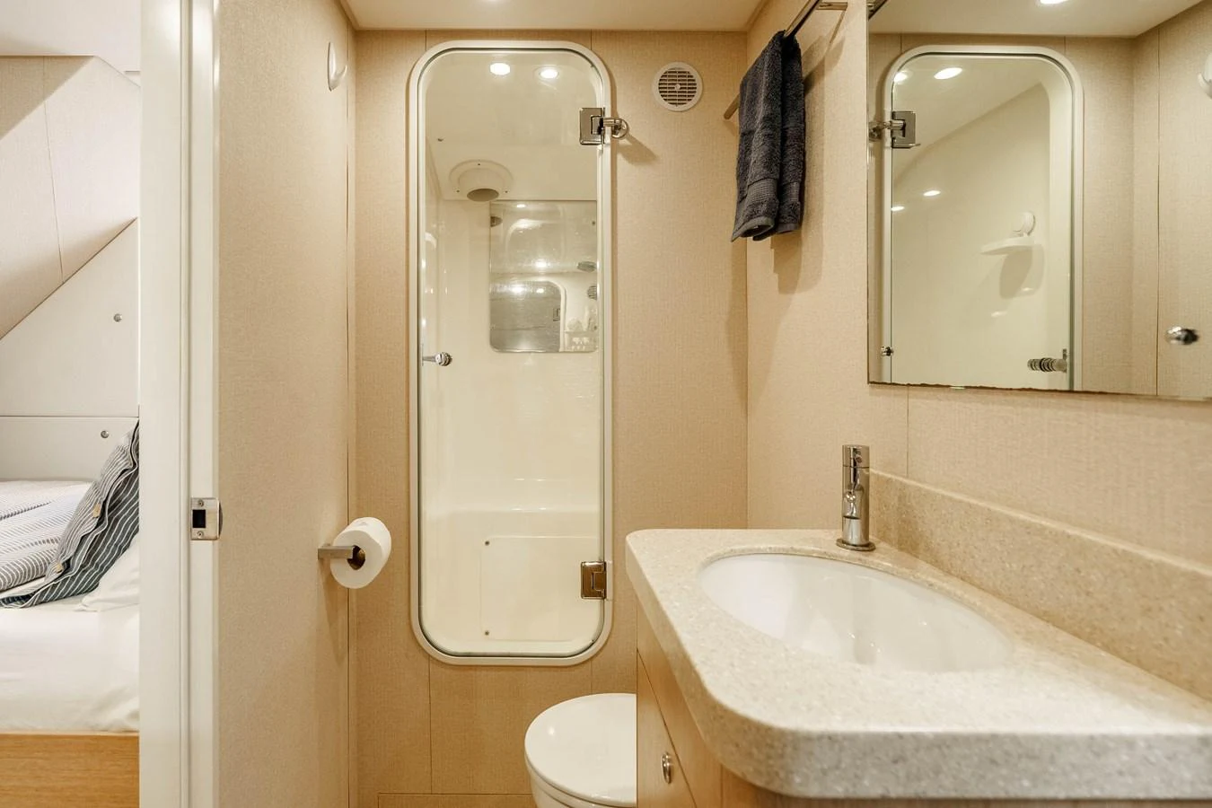 The yacht's bathroom features a sleek design with a modern shower and elegant fixtures. aboard UGLY BETTY Yacht for Sale