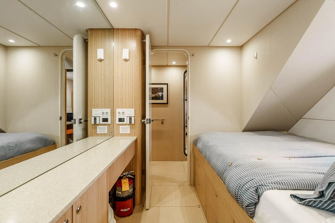 A cozy cabin featuring twin beds and modern amenities. aboard UGLY BETTY Yacht for Sale