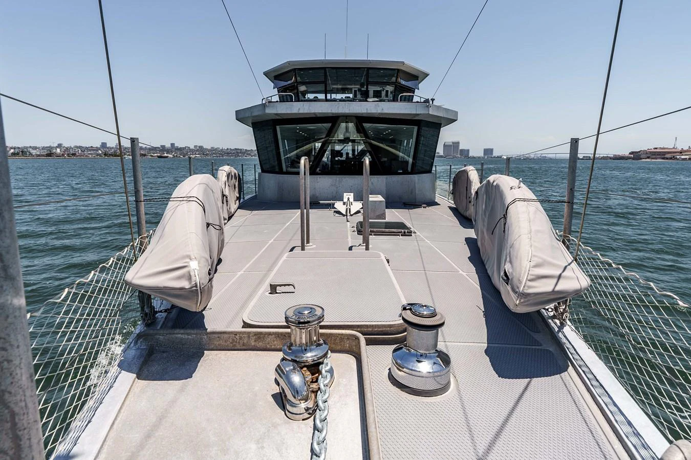 The foredeck of this yacht offers a spacious and functional area with a clear view towards the helm. aboard UGLY BETTY Yacht for Sale