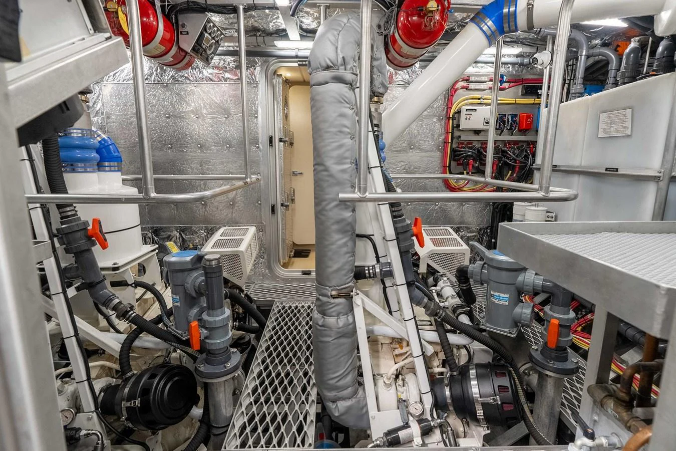 The engine room is meticulously organized with advanced machinery and safety equipment. aboard UGLY BETTY Yacht for Sale