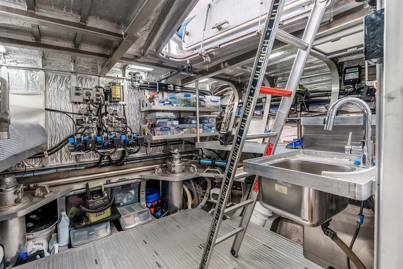 The engine room is meticulously organized with advanced equipment and tools. aboard UGLY BETTY Yacht for Sale