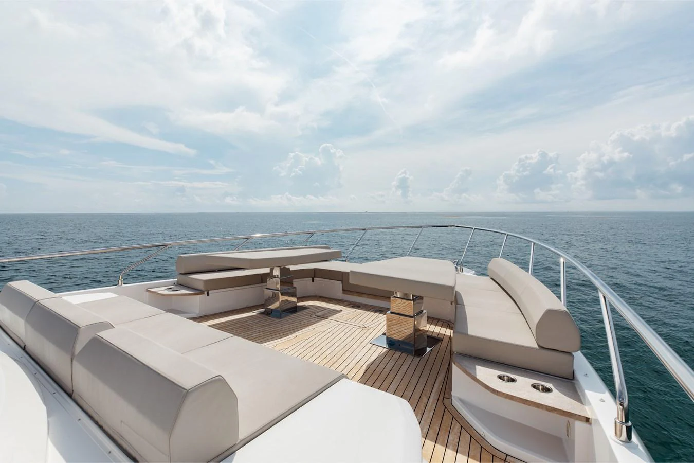 The foredeck features luxurious seating and lounging areas with a stunning ocean backdrop. aboard KATRIN I Yacht for Sale