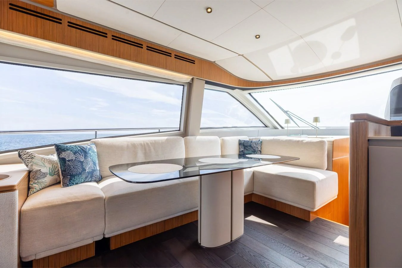 The salon features a spacious seating area with large windows providing a panoramic view. aboard KATRIN I Yacht for Sale