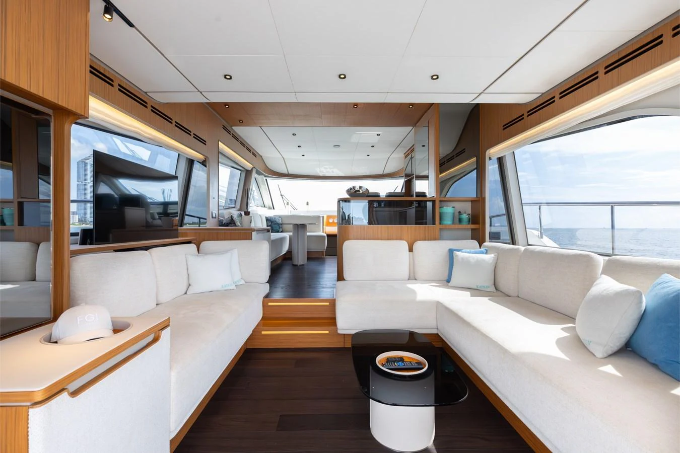 The salon features a spacious and modern seating area with ample natural light and elegant decor. aboard KATRIN I Yacht for Sale
