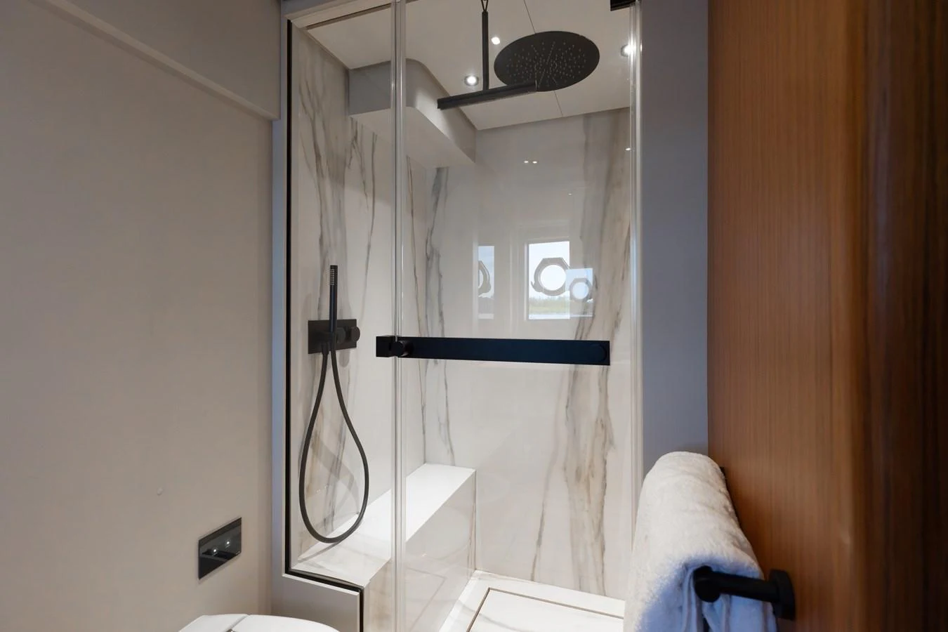 The yacht's bathroom features a sleek, modern design with a glass-enclosed shower and elegant fixtures. aboard KATRIN I Yacht for Sale