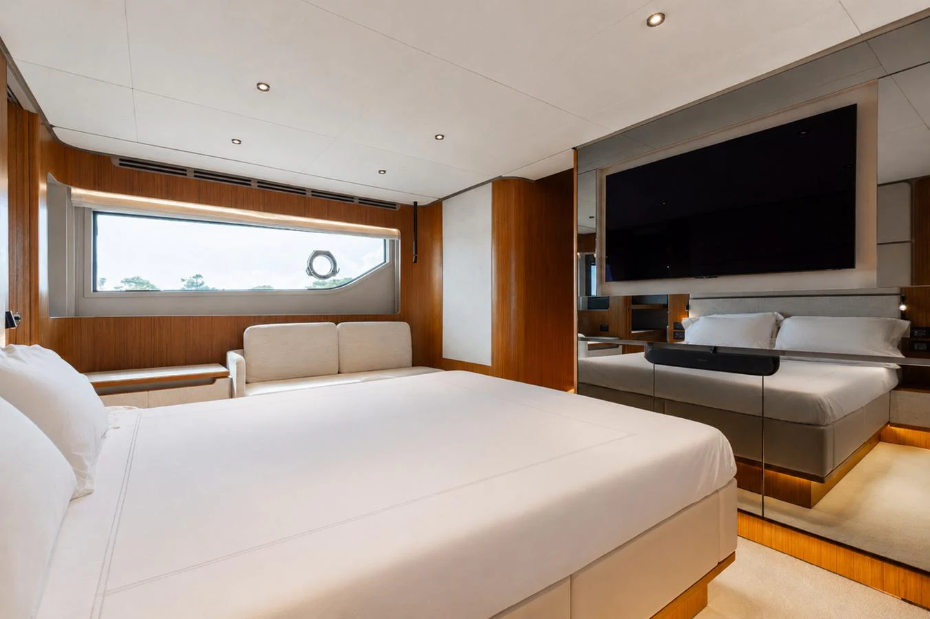 The master stateroom features a spacious bed, a large window, and a flat-screen TV, creating a serene and luxurious retreat. aboard KATRIN I Yacht for Sale