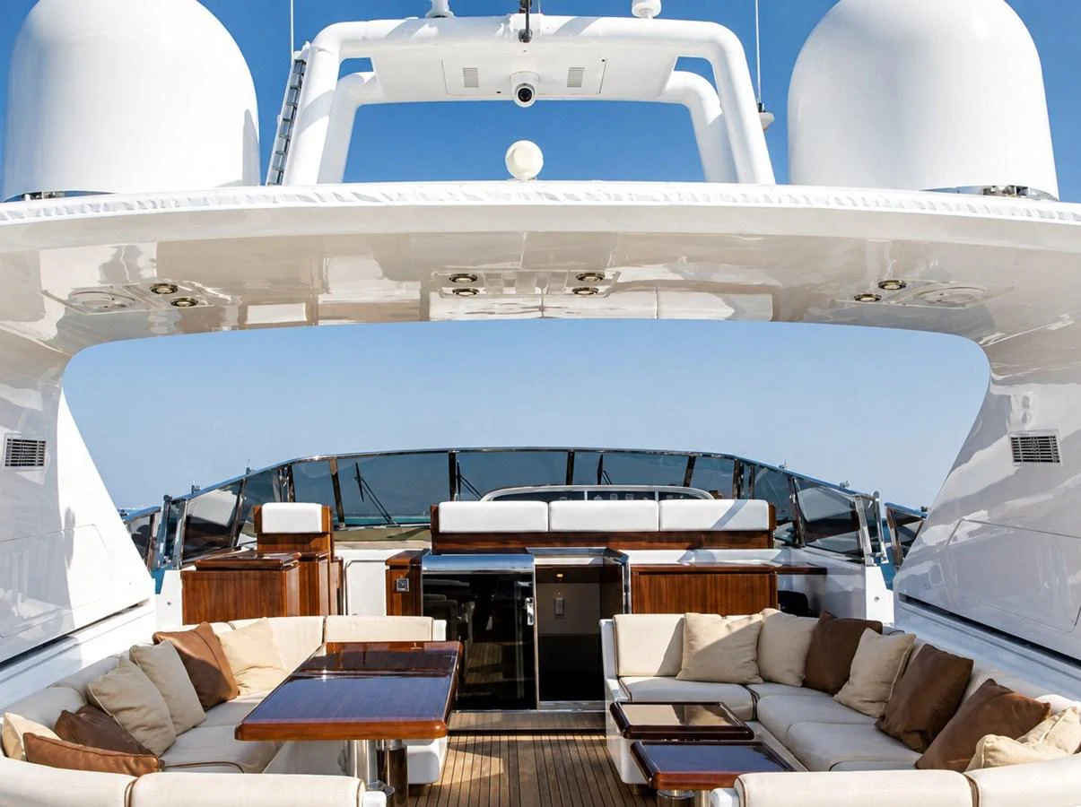 The flybridge offers a luxurious outdoor seating area with plush cushions and a well-equipped bar. aboard ANGELINA Yacht for Sale