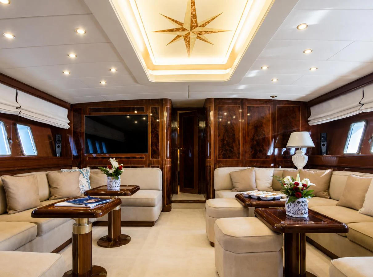 The yacht's salon features luxurious seating and elegant decor, creating a warm and inviting atmosphere. aboard ANGELINA Yacht for Sale