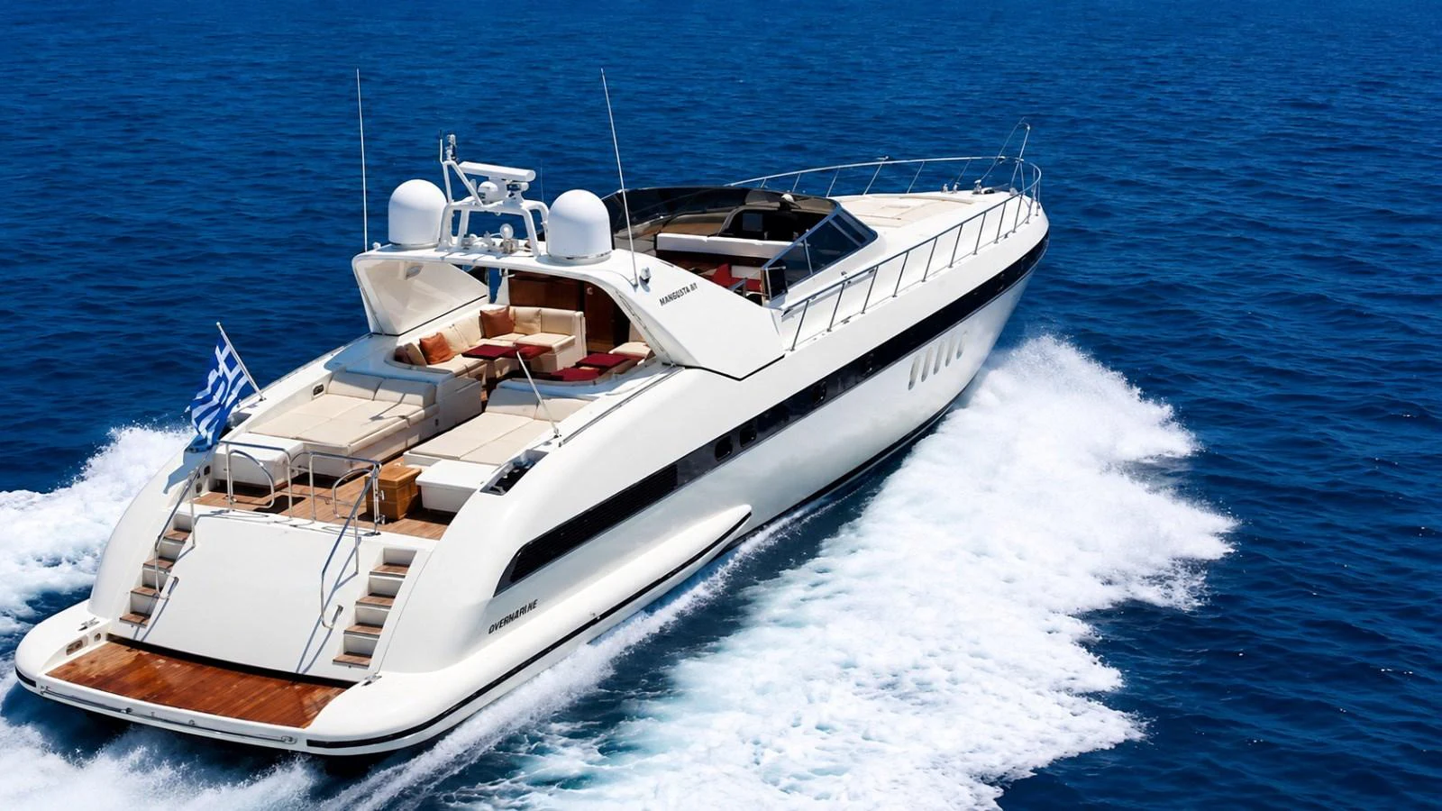 A sleek and modern yacht cruises swiftly through the open sea, showcasing its luxurious design and spacious deck. aboard ANGELINA Yacht for Sale