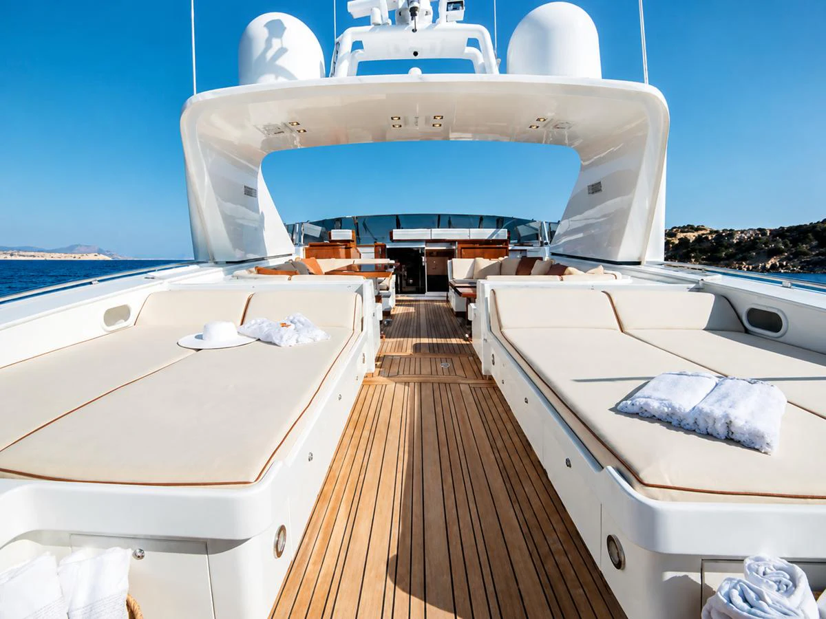 The sundeck offers luxurious lounging with expansive sunbeds and a stunning view of the sea. aboard ANGELINA Yacht for Sale