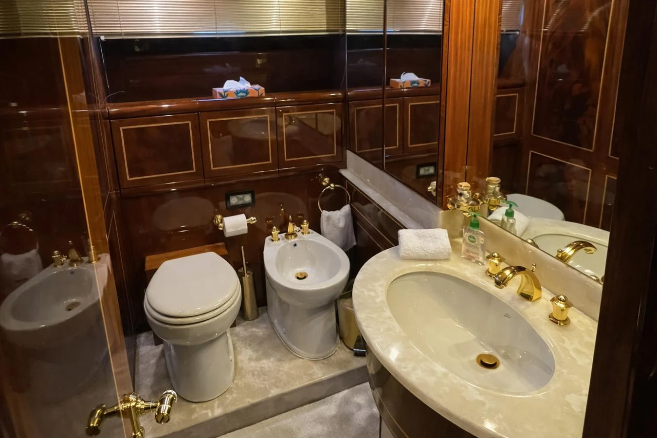 This elegant yacht bathroom features luxurious fixtures and a sophisticated design. aboard ANGELINA Yacht for Sale