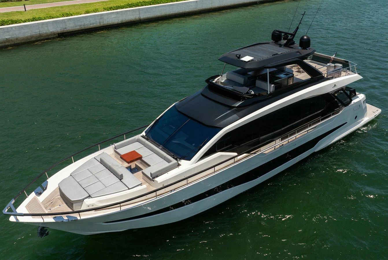 A sleek and modern yacht cruising in calm waters, showcasing its luxurious design and spacious deck areas. aboard HOTEL COLLECTION Yacht for Sale