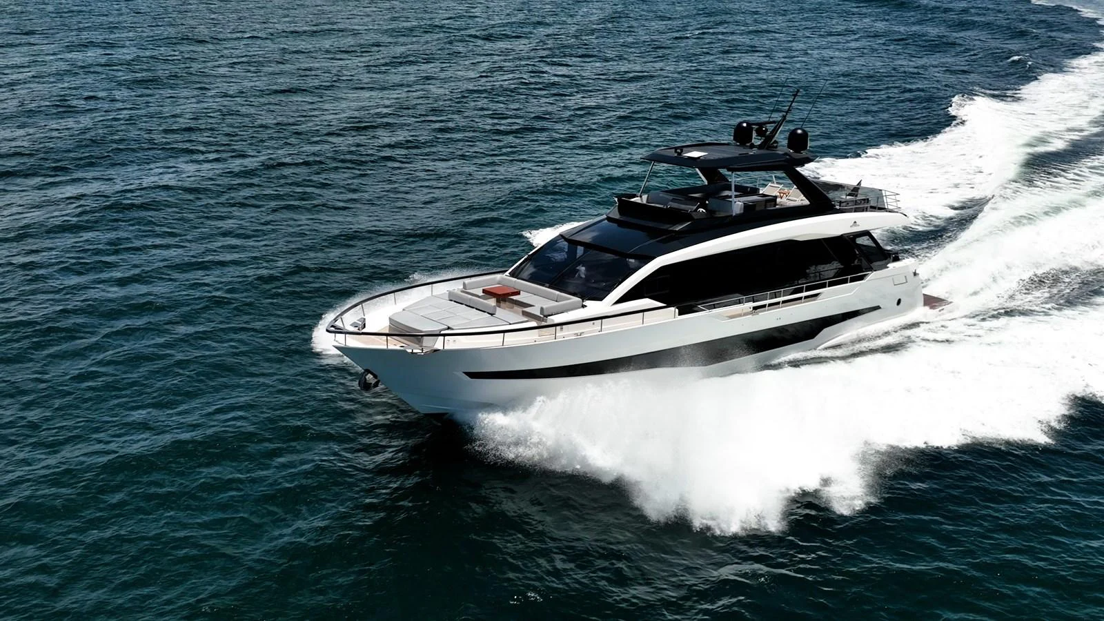 A sleek and modern yacht cruises swiftly through the open water. aboard HOTEL COLLECTION Yacht for Sale