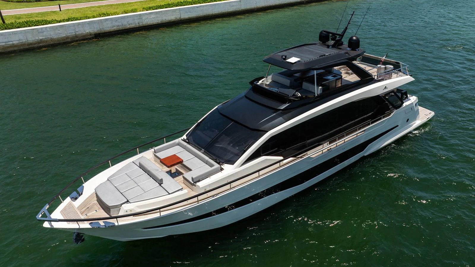 A sleek and modern yacht cruising on calm waters, showcasing its luxurious design and spacious deck areas. aboard HOTEL COLLECTION Yacht for Sale