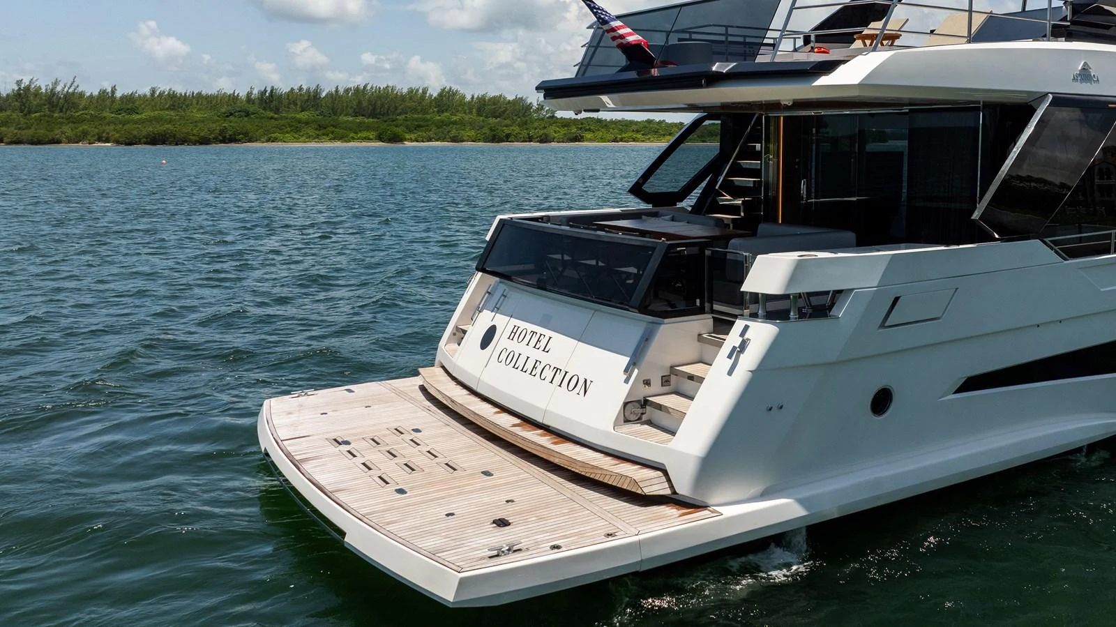 The yacht's stern showcases a spacious swim platform and elegant design. aboard HOTEL COLLECTION Yacht for Sale