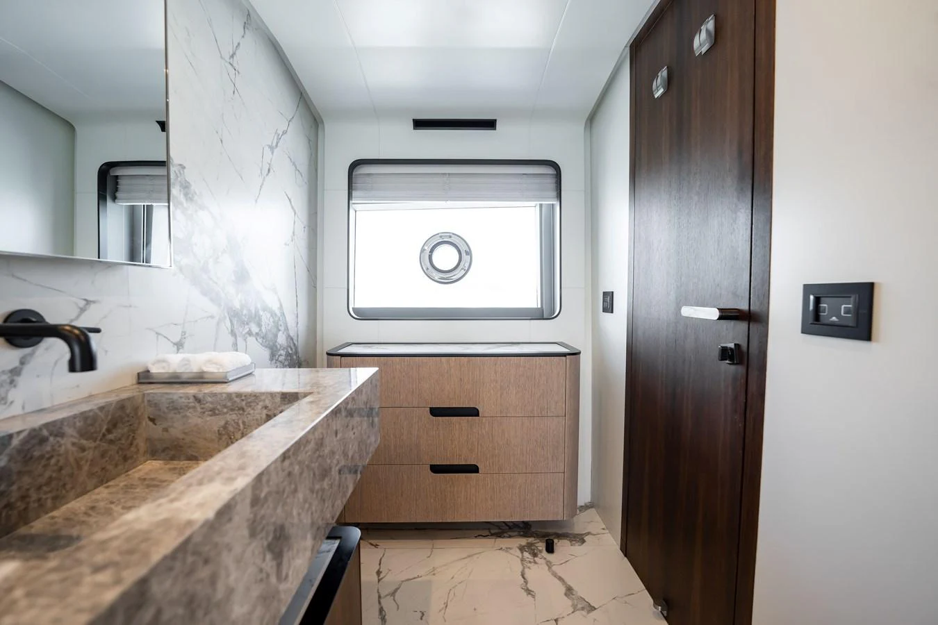 The yacht's bathroom features elegant marble surfaces and modern fixtures, creating a luxurious and serene environment. aboard HOTEL COLLECTION Yacht for Sale