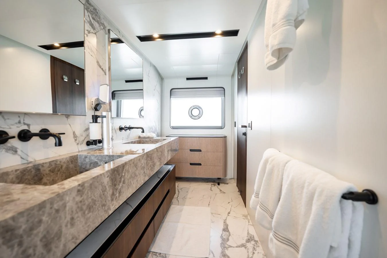 The bathroom features luxurious marble finishes and modern fixtures. aboard HOTEL COLLECTION Yacht for Sale