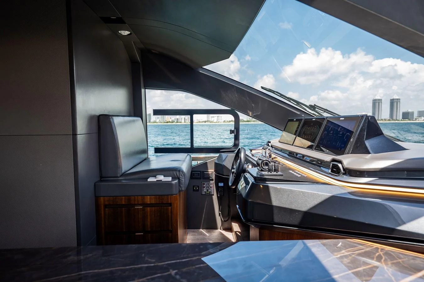 The helm station offers a sleek and modern design with advanced navigation equipment and a panoramic view of the sea. aboard HOTEL COLLECTION Yacht for Sale