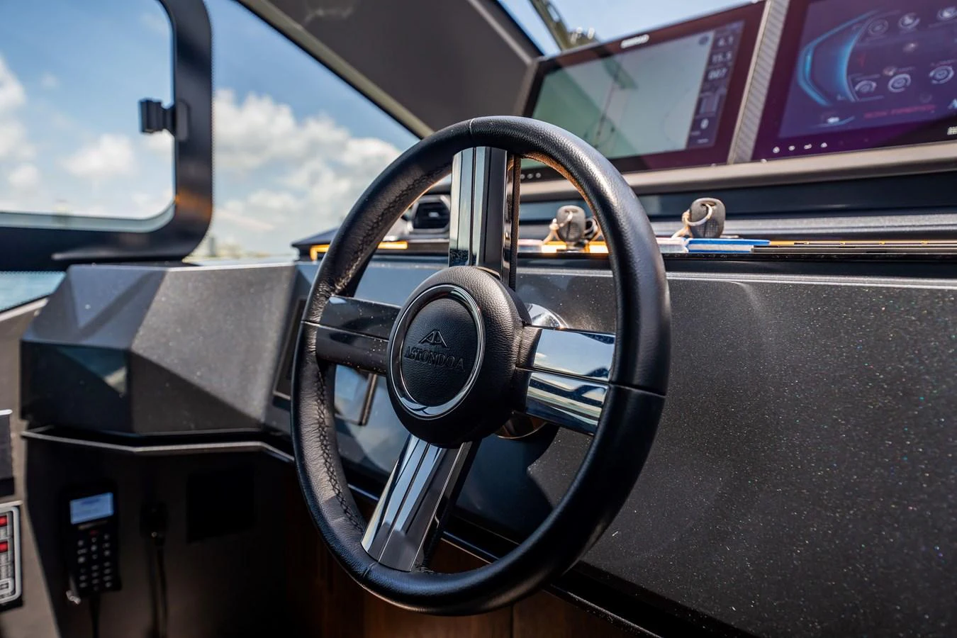The helm features a sleek steering wheel and advanced navigation systems. aboard HOTEL COLLECTION Yacht for Sale