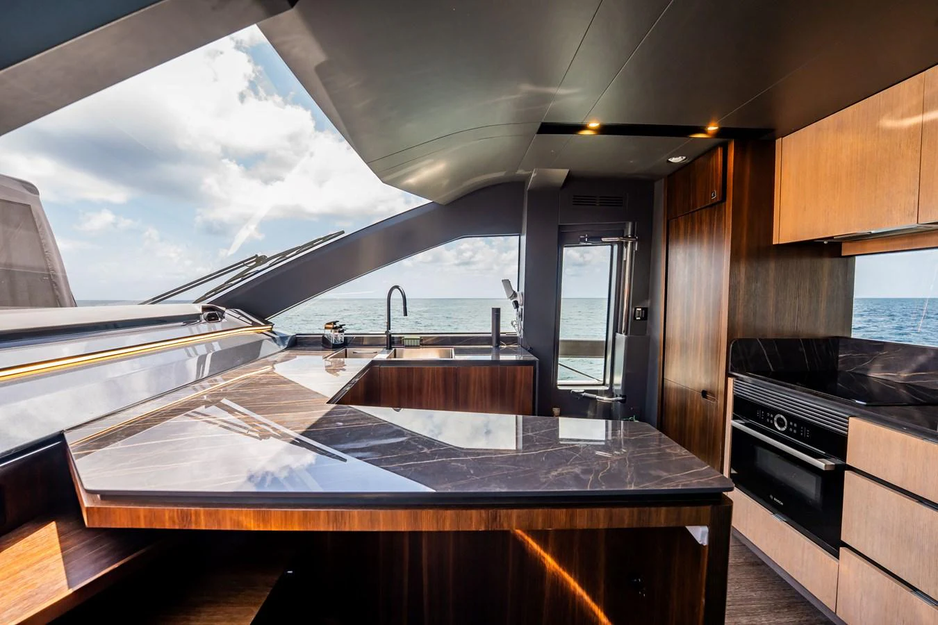The yacht's galley features sleek, modern design with high-end finishes and expansive ocean views. aboard HOTEL COLLECTION Yacht for Sale