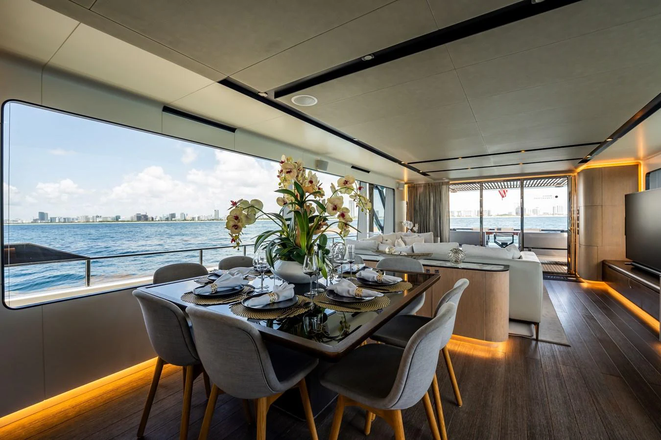 The yacht's dining area offers a luxurious setting with panoramic views of the water. aboard HOTEL COLLECTION Yacht for Sale