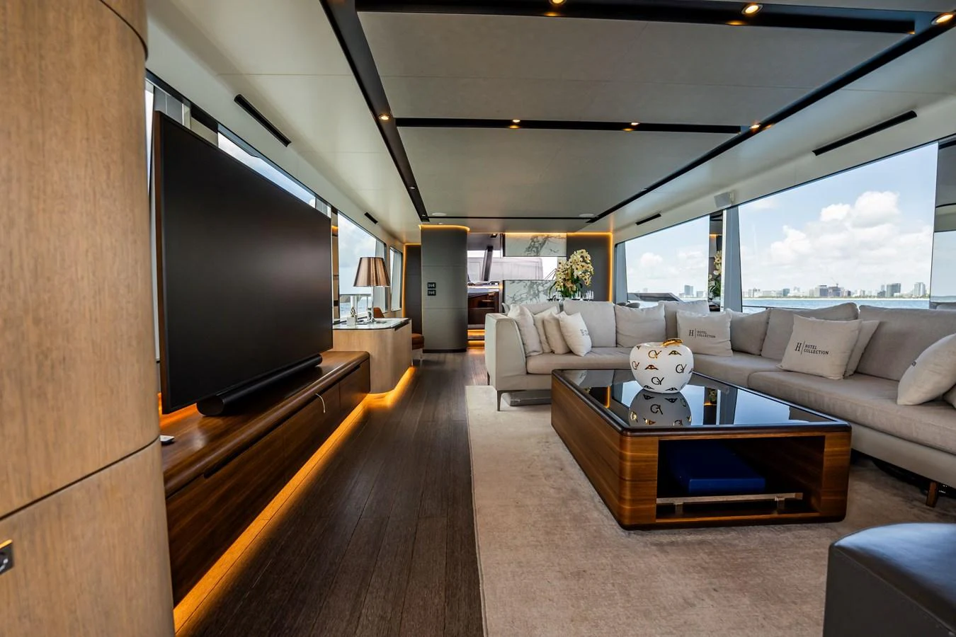 The salon features a spacious and modern design with luxurious furnishings and ample natural light. aboard HOTEL COLLECTION Yacht for Sale