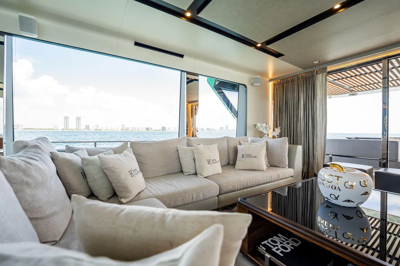 The salon offers a luxurious and comfortable seating area with panoramic views of the water. aboard HOTEL COLLECTION Yacht for Sale
