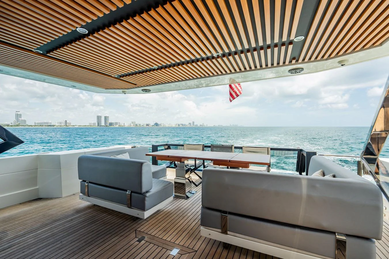 The aft deck offers a spacious and stylish outdoor dining area with stunning ocean views. aboard HOTEL COLLECTION Yacht for Sale