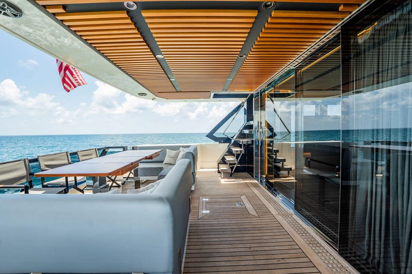 The aft deck offers a spacious and stylish area for alfresco dining and relaxation with stunning ocean views. aboard HOTEL COLLECTION Yacht for Sale