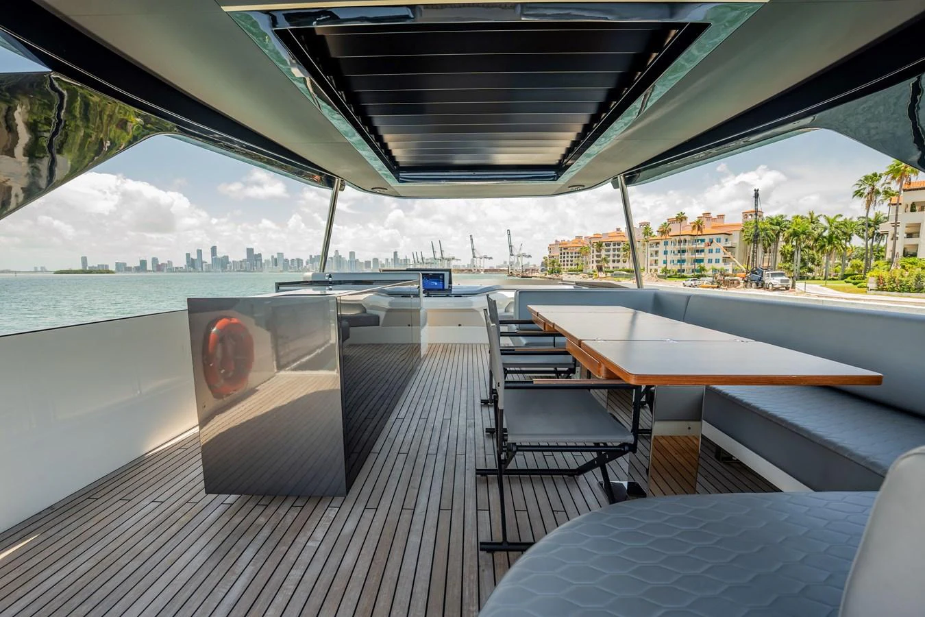 The aft deck offers a spacious and stylish area for dining and relaxation with stunning views of the surrounding waters. aboard HOTEL COLLECTION Yacht for Sale