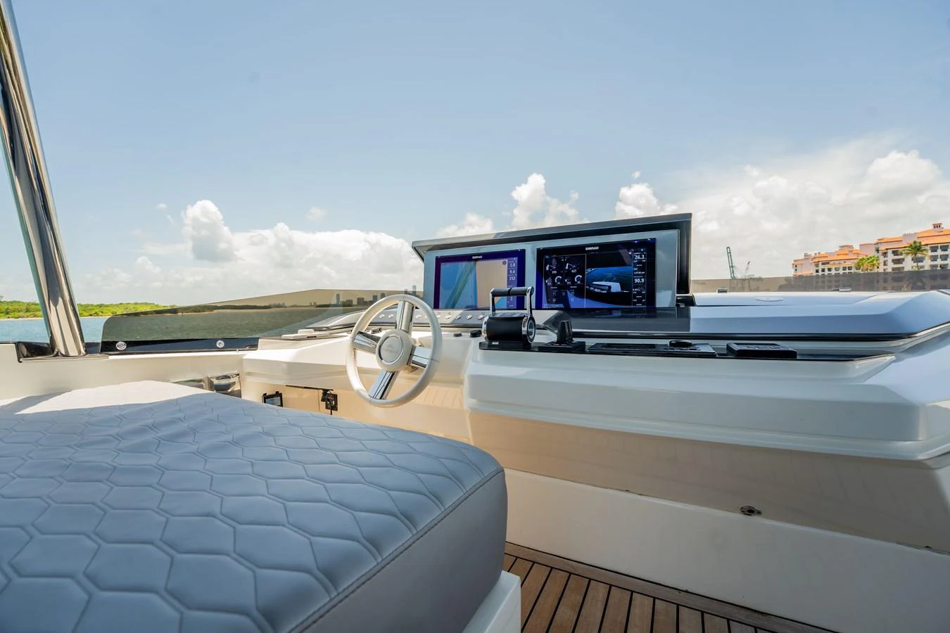 The helm station features modern navigation equipment and a comfortable seating area. aboard HOTEL COLLECTION Yacht for Sale