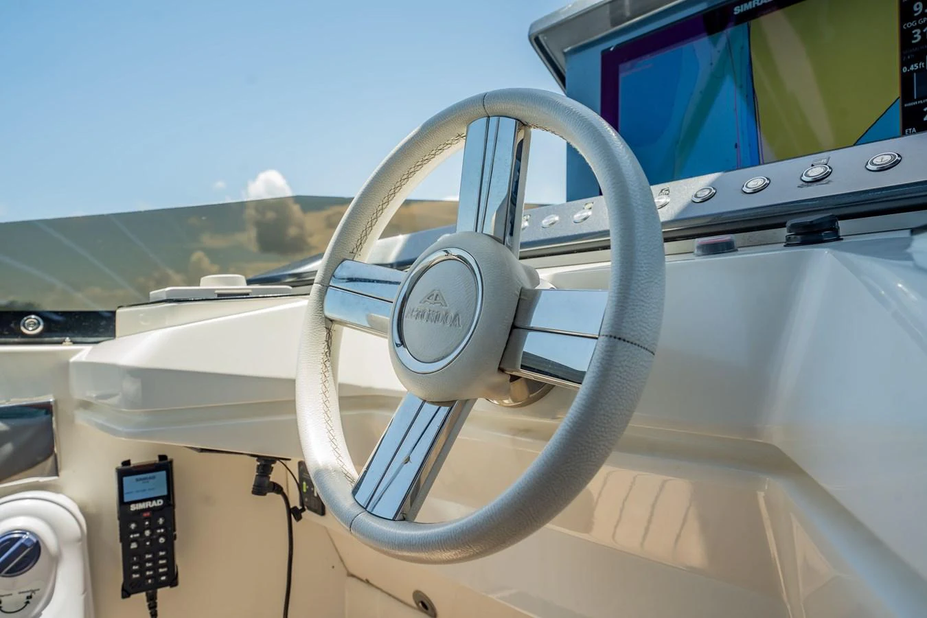 The helm station features a sleek steering wheel and advanced navigation equipment. aboard HOTEL COLLECTION Yacht for Sale