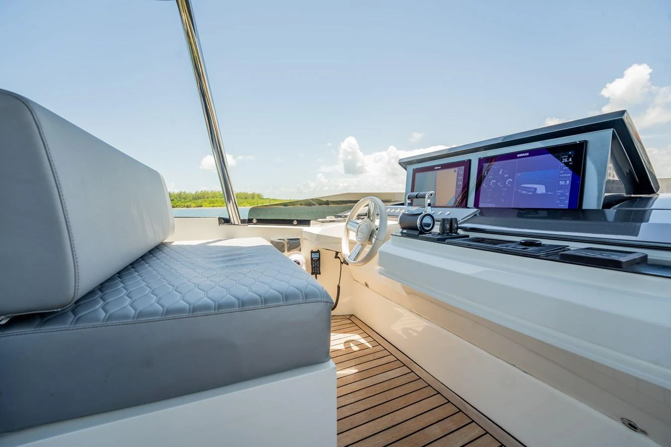 The helm station features modern navigation equipment and a comfortable seating area. aboard HOTEL COLLECTION Yacht for Sale