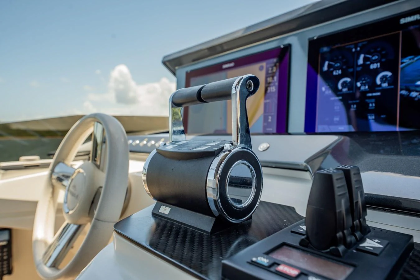 A close-up of the yacht's helm showcasing advanced navigation and control systems. aboard HOTEL COLLECTION Yacht for Sale