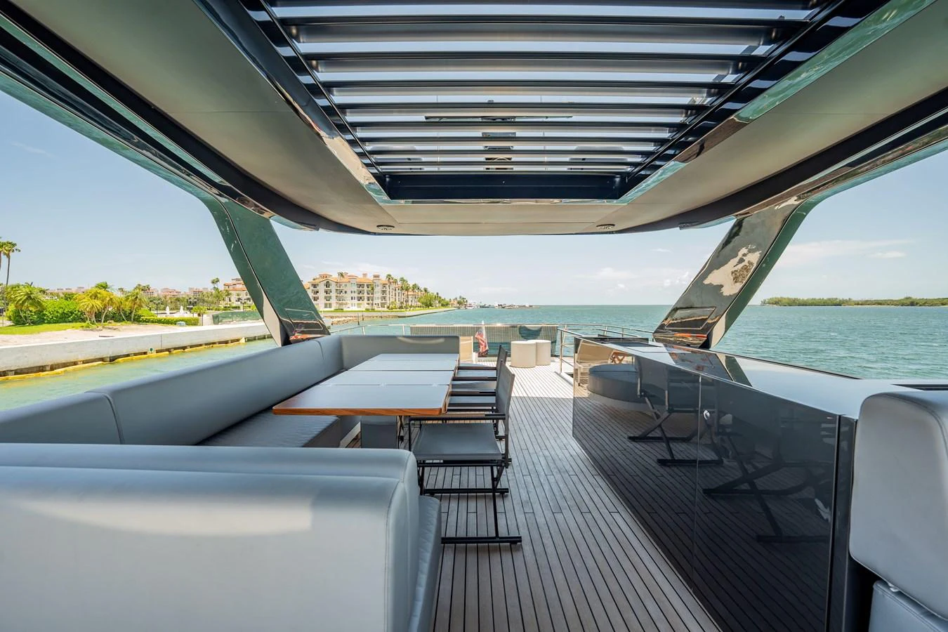 The aft deck offers a spacious and stylish area for outdoor dining and relaxation with stunning views. aboard HOTEL COLLECTION Yacht for Sale