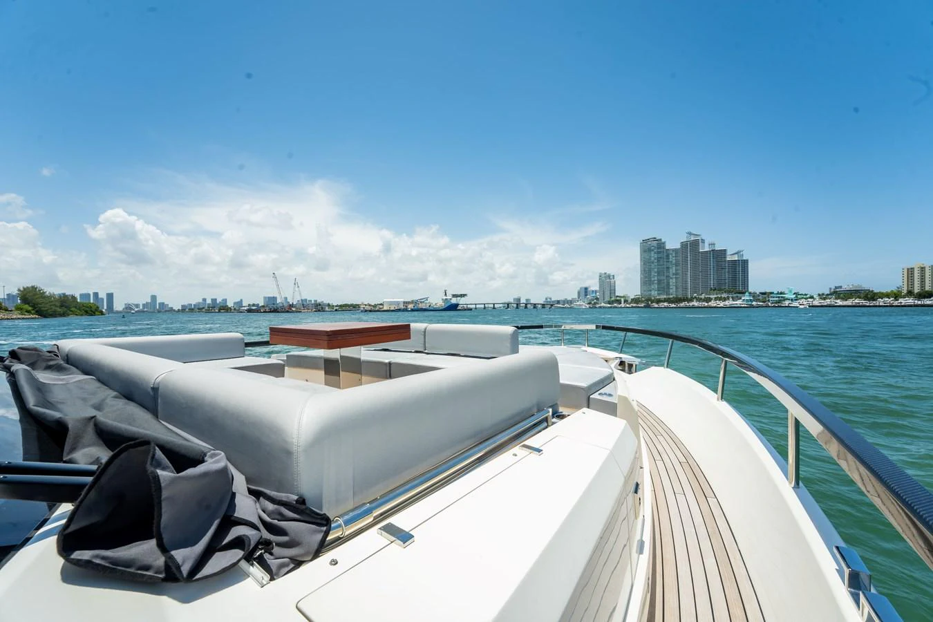 The yacht's aft deck offers a spacious and inviting area with comfortable seating and stunning views of the city skyline. aboard HOTEL COLLECTION Yacht for Sale
